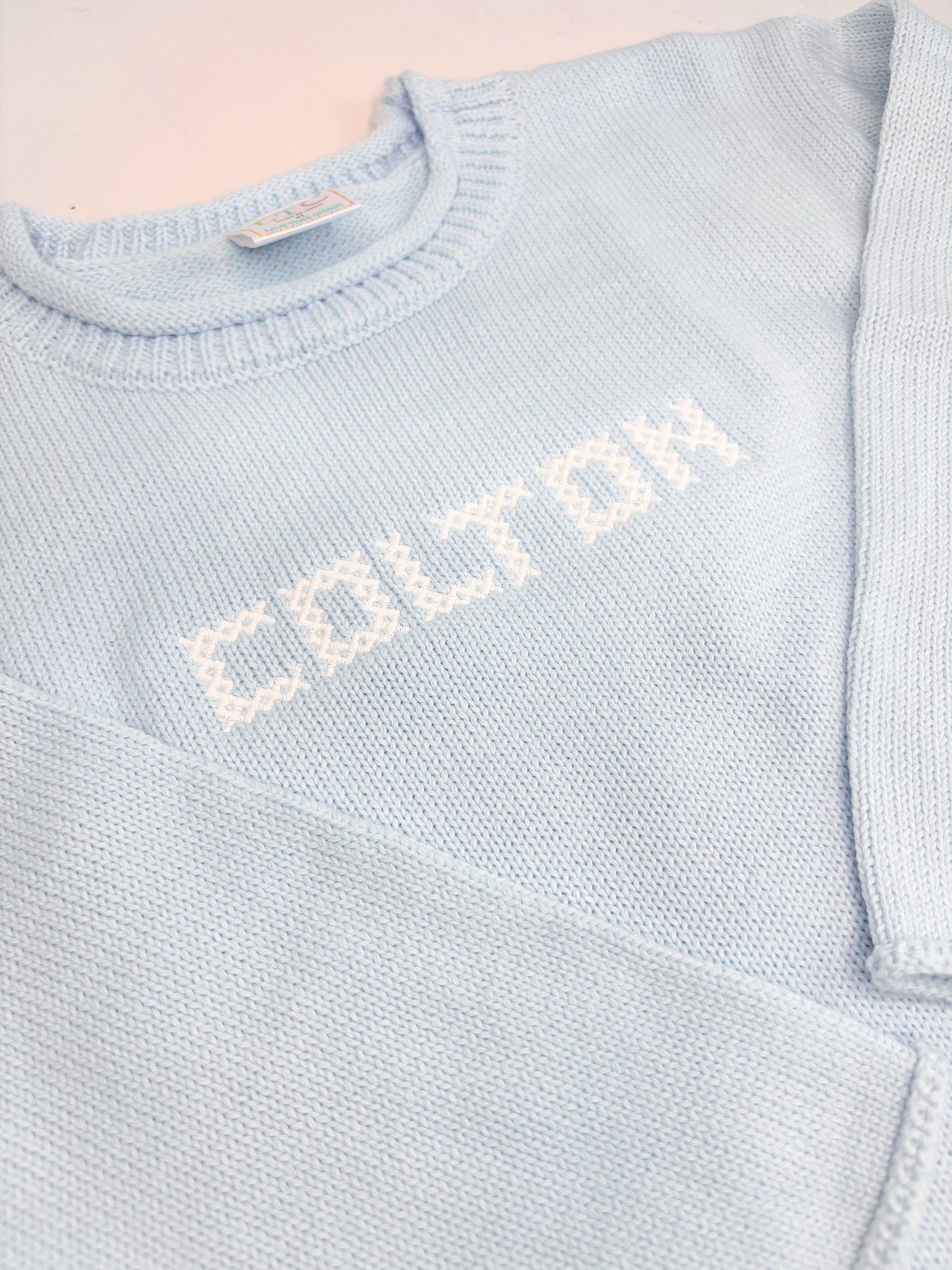 Unisex Roll Neck Sweater With Cross Stitch Font