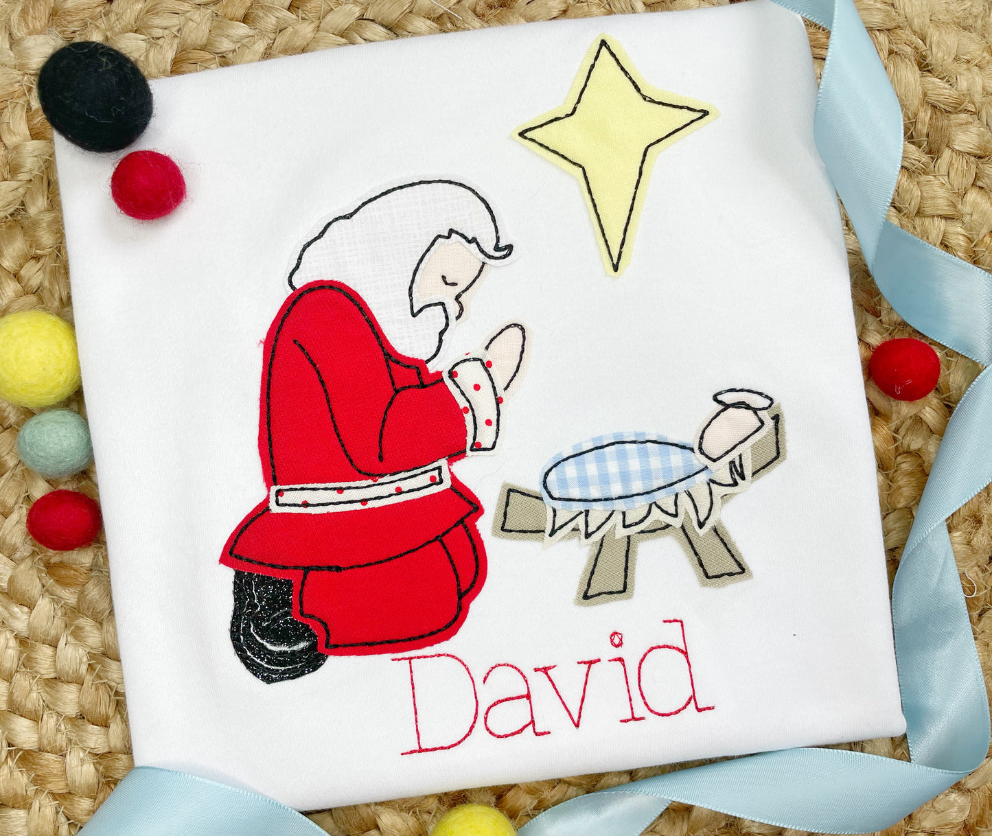 Kneeling Santa and Baby Jesus Applique design
